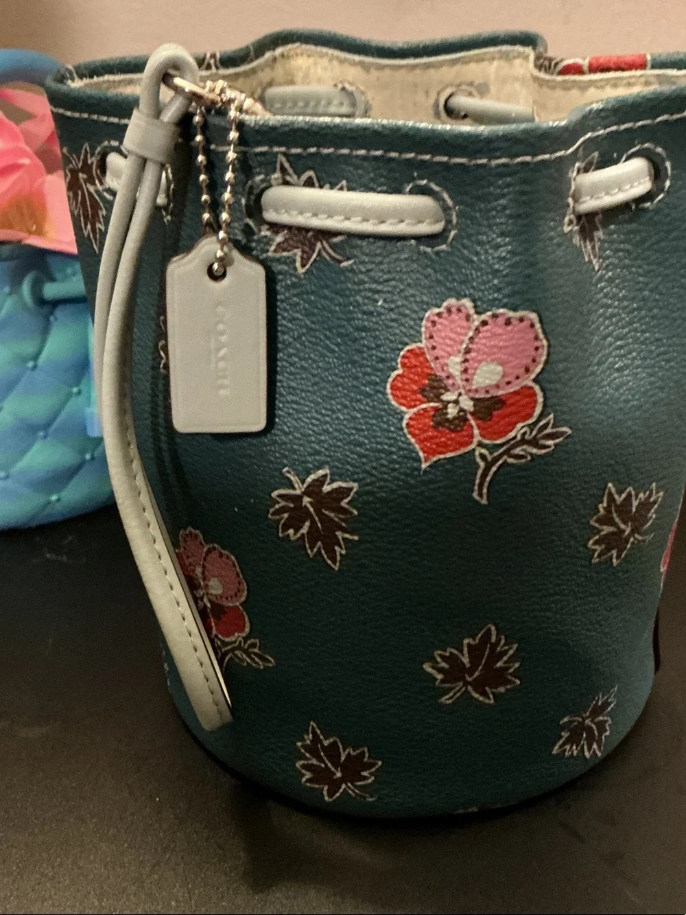 Coach Teal Floral Mini Drawstring Bucket Bag (rim has wear)